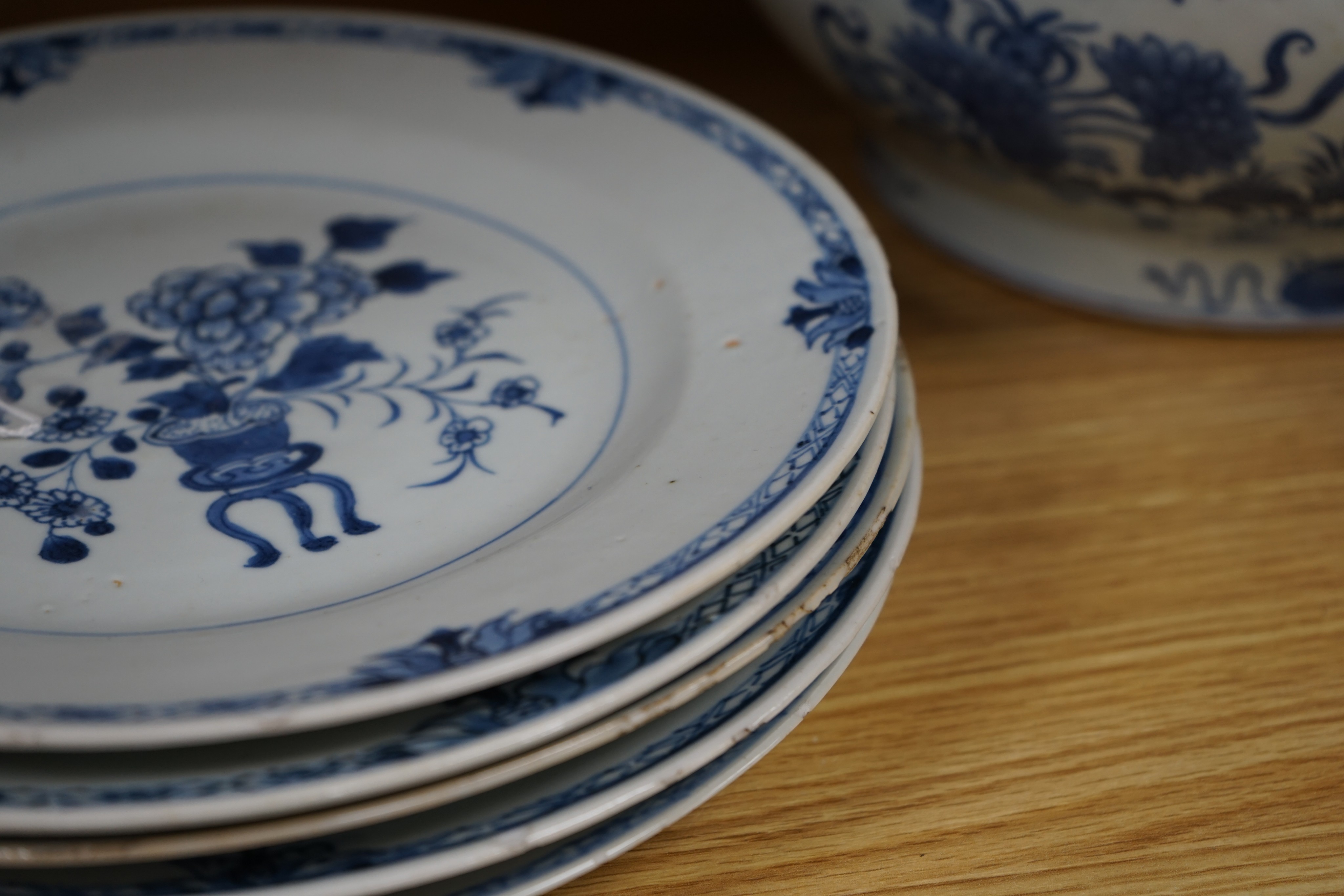 An 18th century Chinese Export blue and white octagonal tureen and cover, decorated with birds and flowers, a pair of similar sauceboats and five plates decorated with urns of flowers